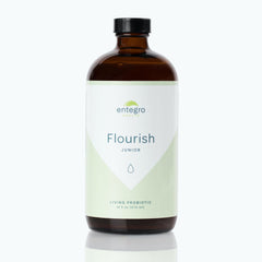 ENTEGRO Flourish Junior bottle in glass for convenient daily probiotic use.