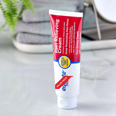 Close-up of Equate Ultra Strength Pain Relieving Cream tube showing smooth application