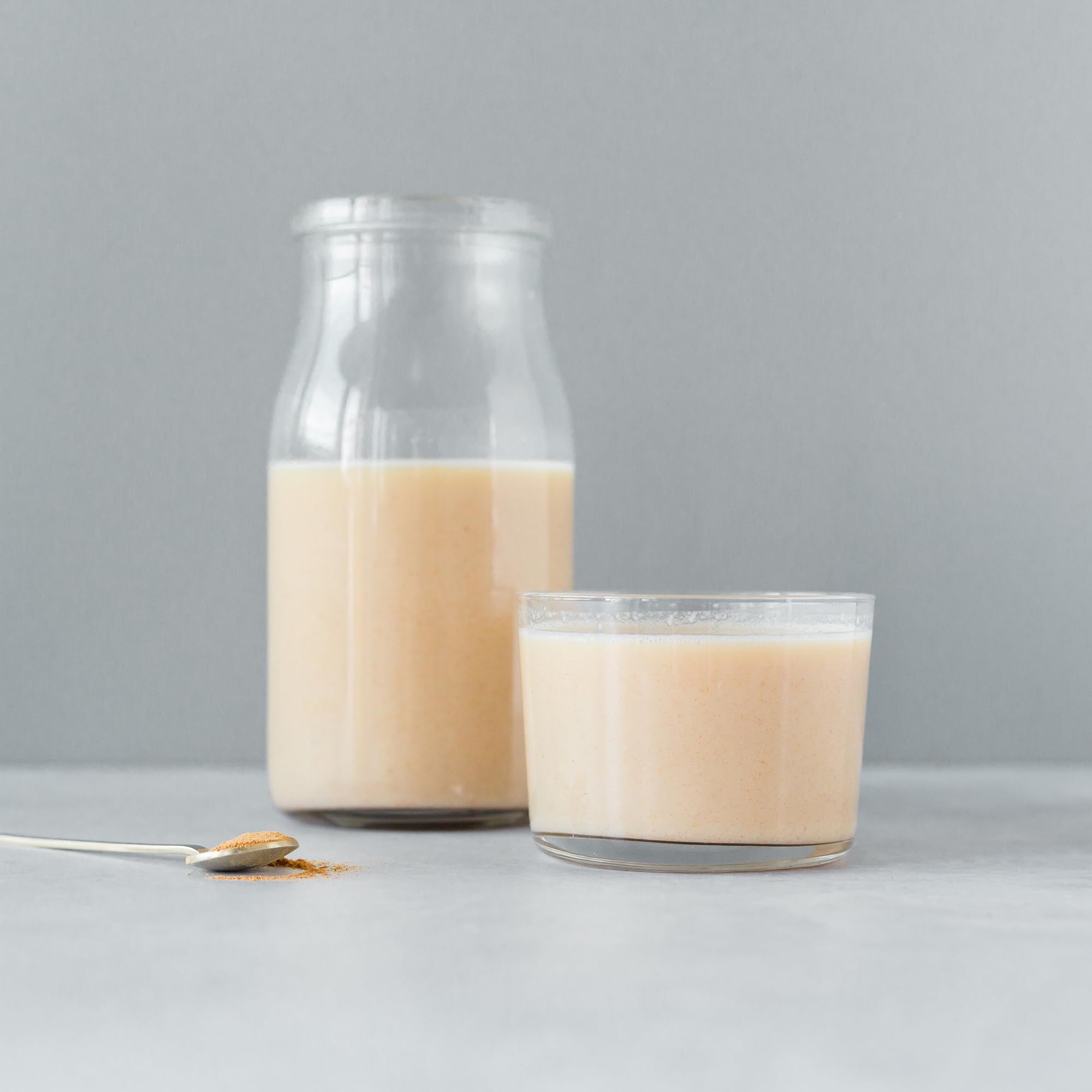 Erbology powder in a cup; versatile addition to beverages and yogurt.