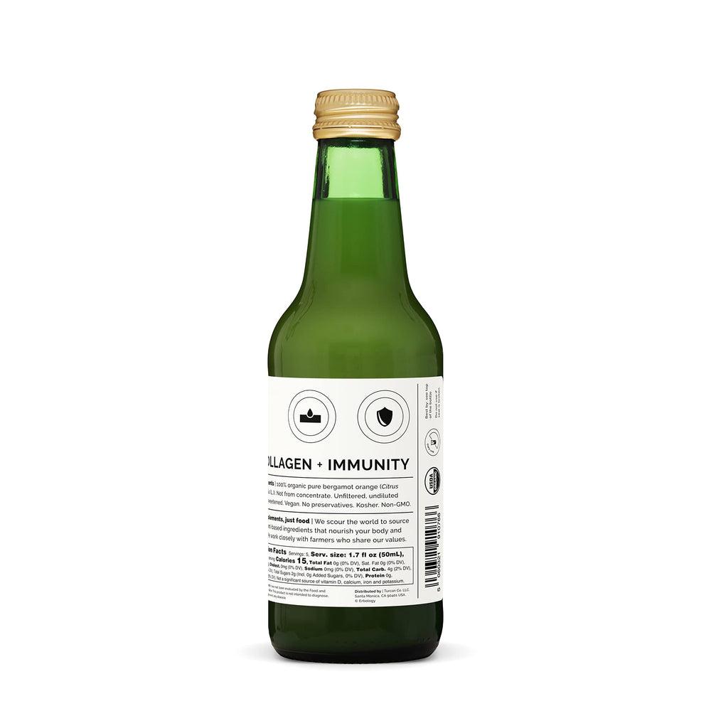 Erbology bergamot juice being poured into a glass for a bright citrus drink