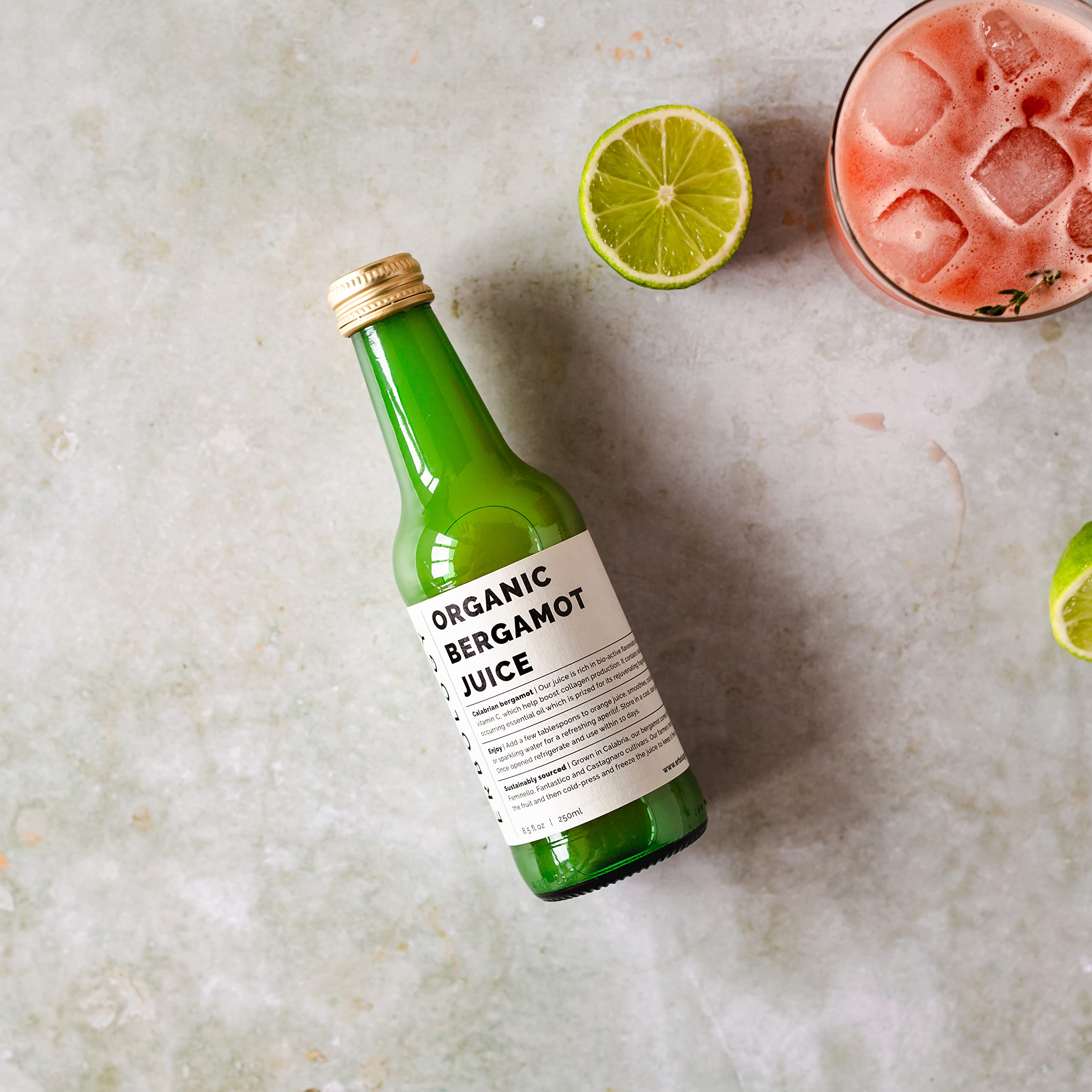 Boxed Erbology bergamot juice packaging emphasizing recyclable glass and sustainability