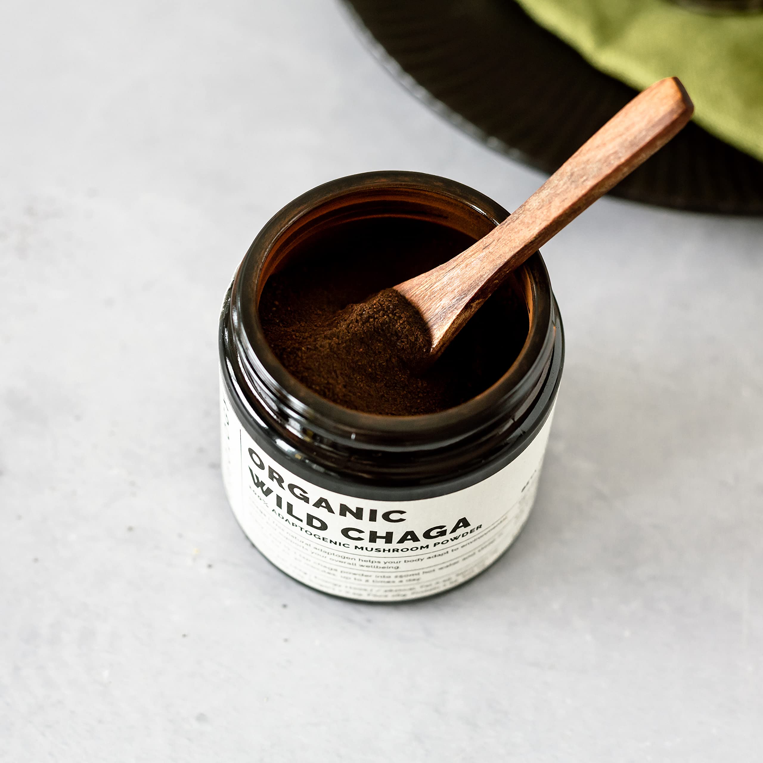 Erbology Chaga powder close-up showing earthy texture for mindful brewing