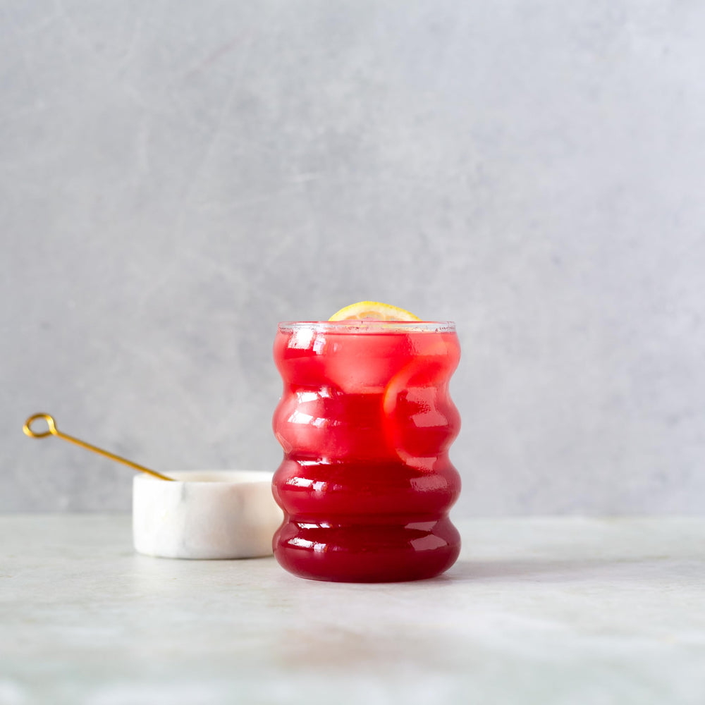 Erbology hibiscus powder in recyclable amber jar packaging emphasizes sustainability
