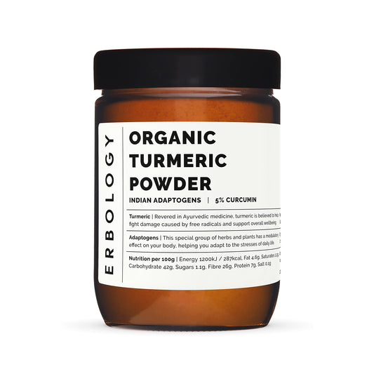Erbology turmeric powder pouring into a warm cup for a fragrant drink