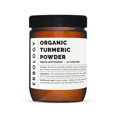 Erbology turmeric powder pouring into a warm cup for a fragrant drink