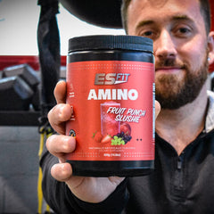 Fruit Punch Slushie ES FIT Amino Powder in a glass, refreshing flavor.