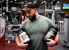 ES FIT Complete MR shake in glass shows creamy texture for post-workout recovery.