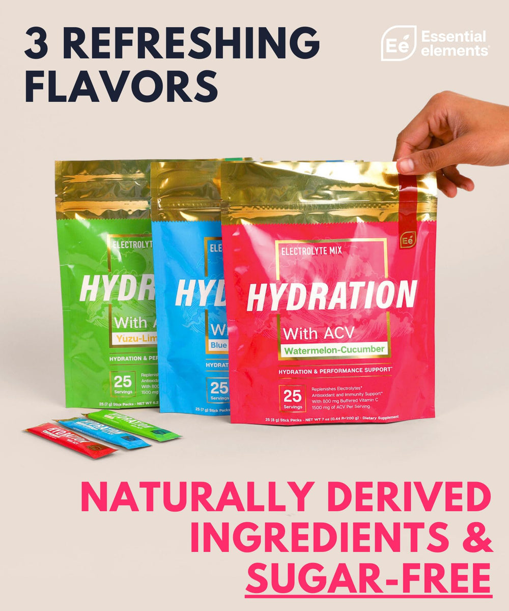 Essential Elements powder dissolving in a glass of water for hydration.