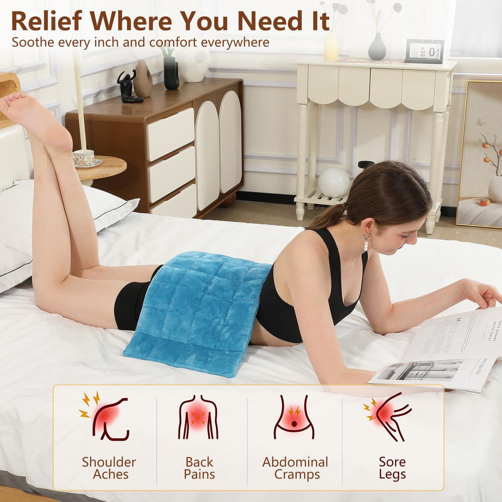 ESTINGO weighted heating pad over the abdomen for warm support and relief.