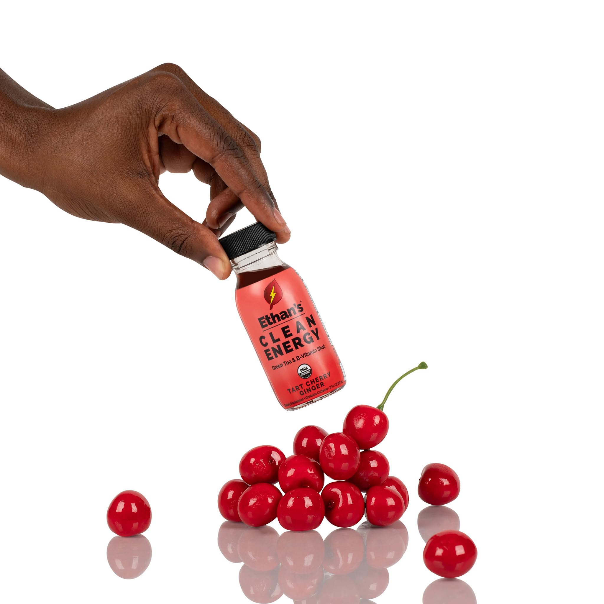 Two-ounce glass bottle of Ethan's energy shot showing real fruit sweetness.