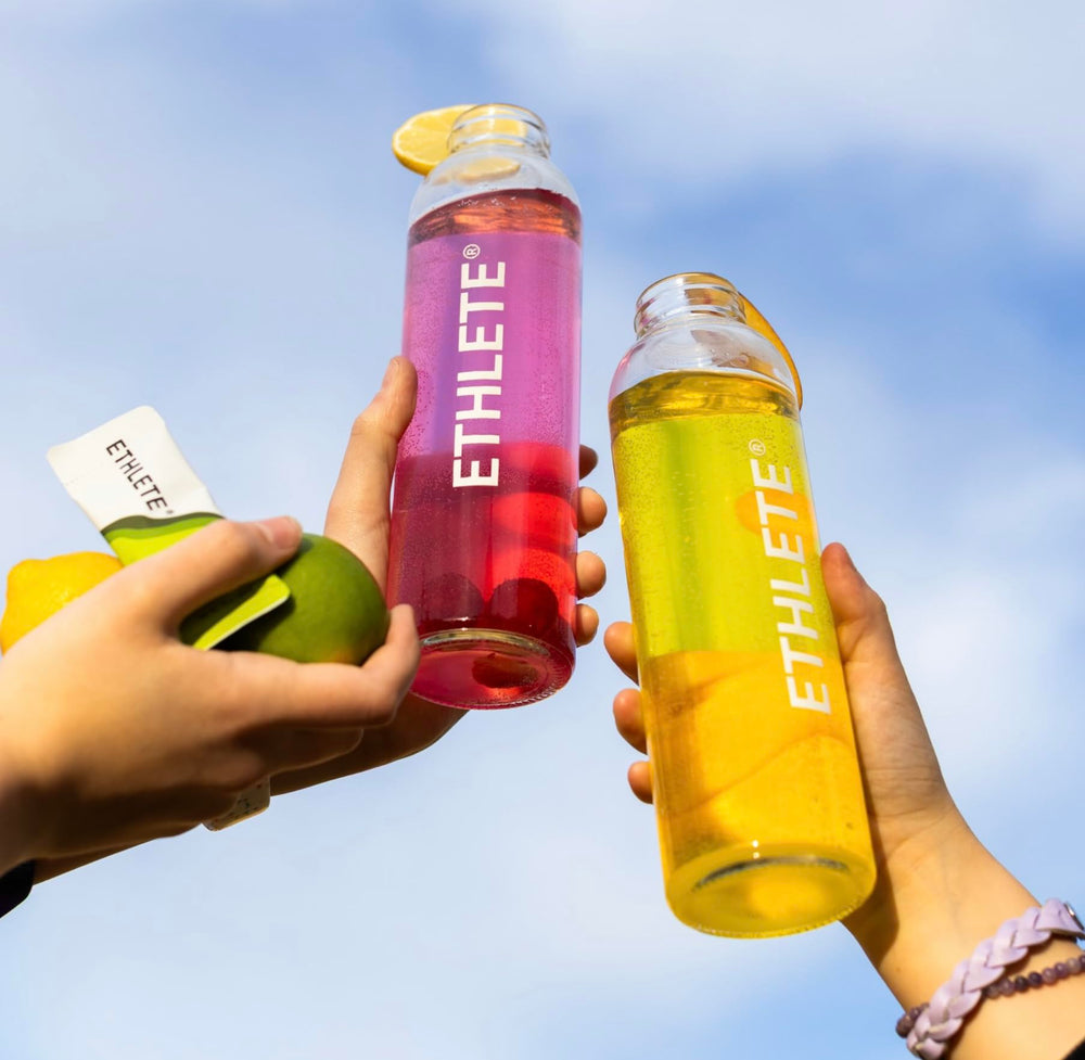Ethlete Electrolytes powder on sports bag, convenient daily hydration.
