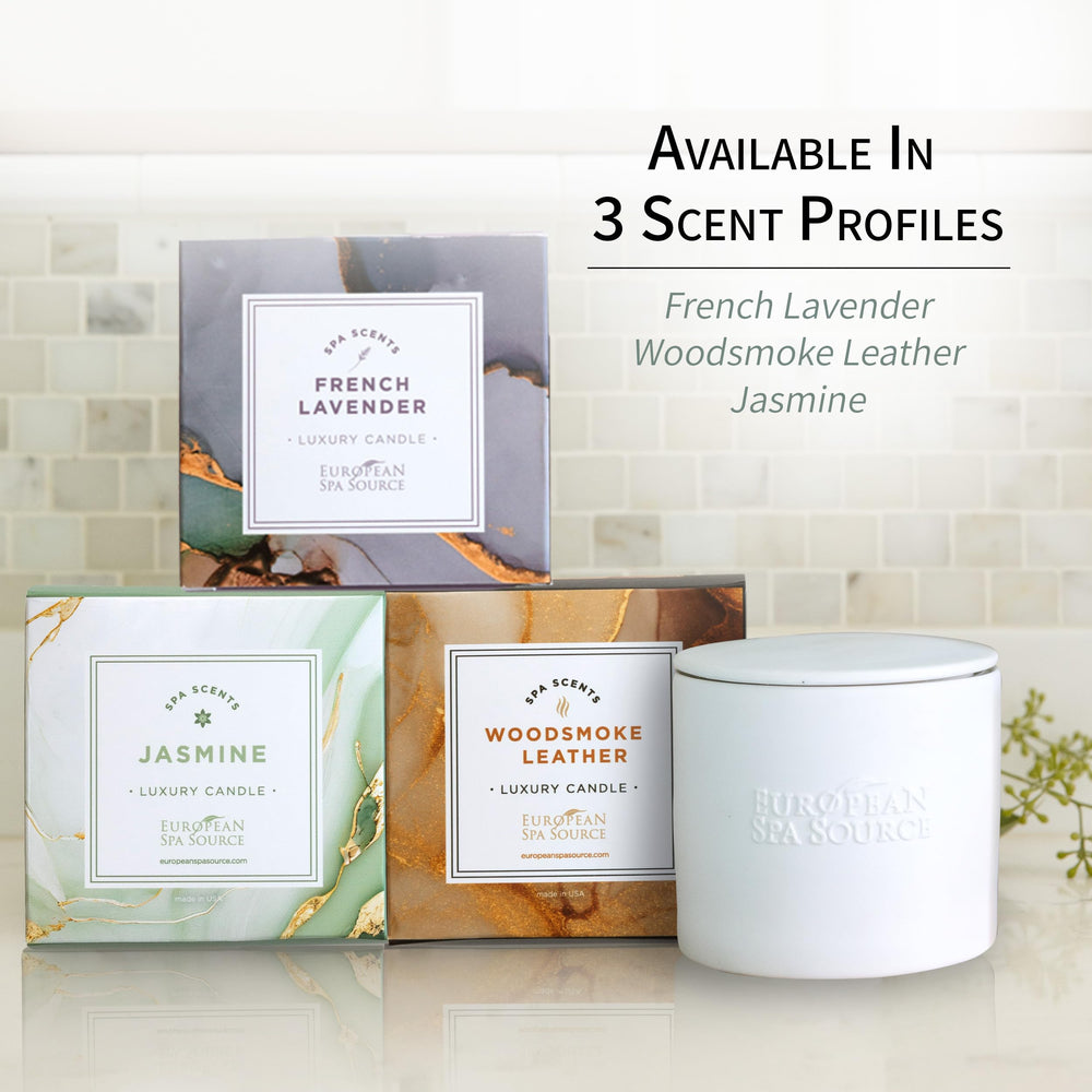 European Spa Source Jasmine Luxury Candle on a coffee table with towels for a spa moment