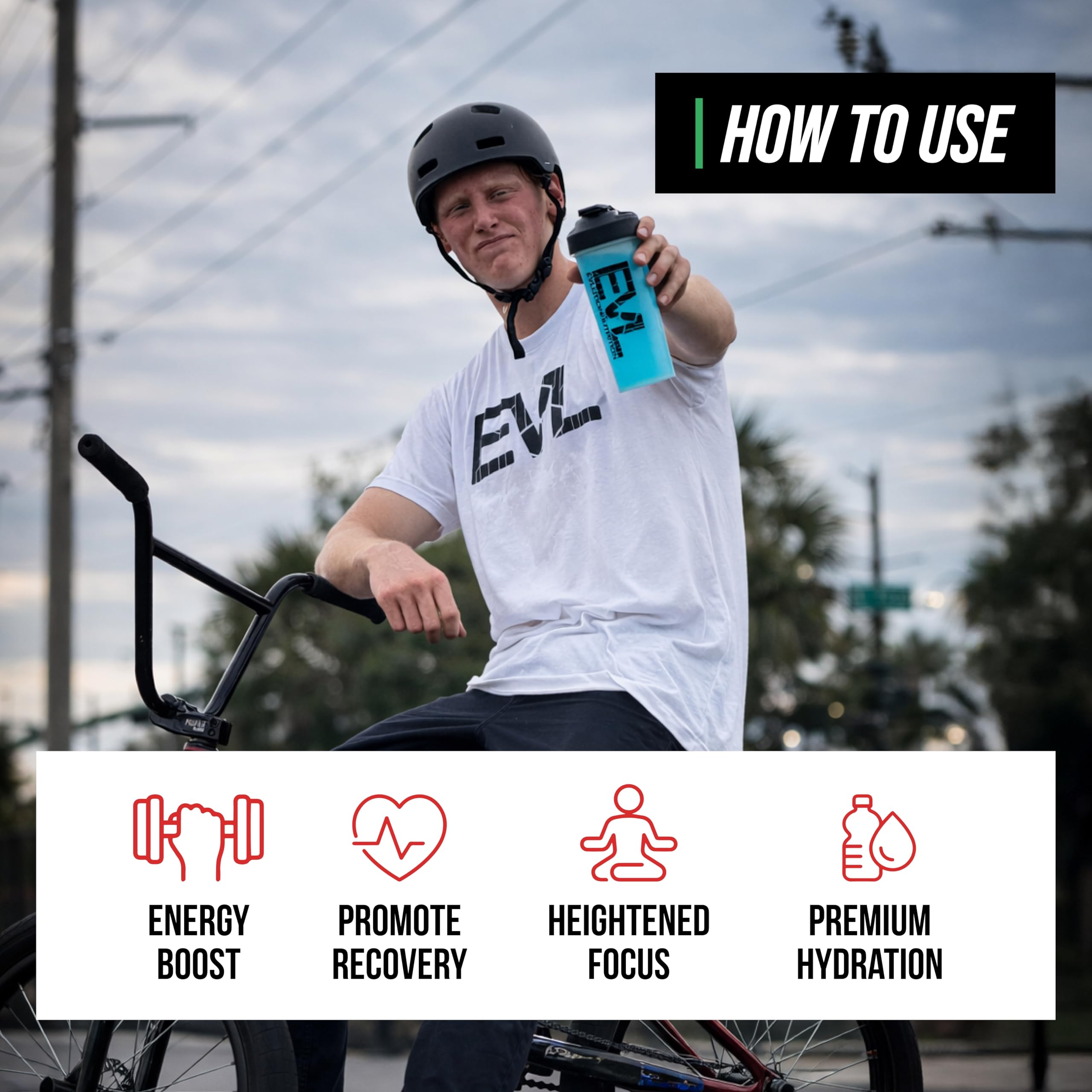 Mixed pink drink of EVL BCAAs during workout for hydration and focus.
