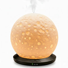 Exqline Moonlight Zen diffuser with ceramic body creates a serene desk ambiance.