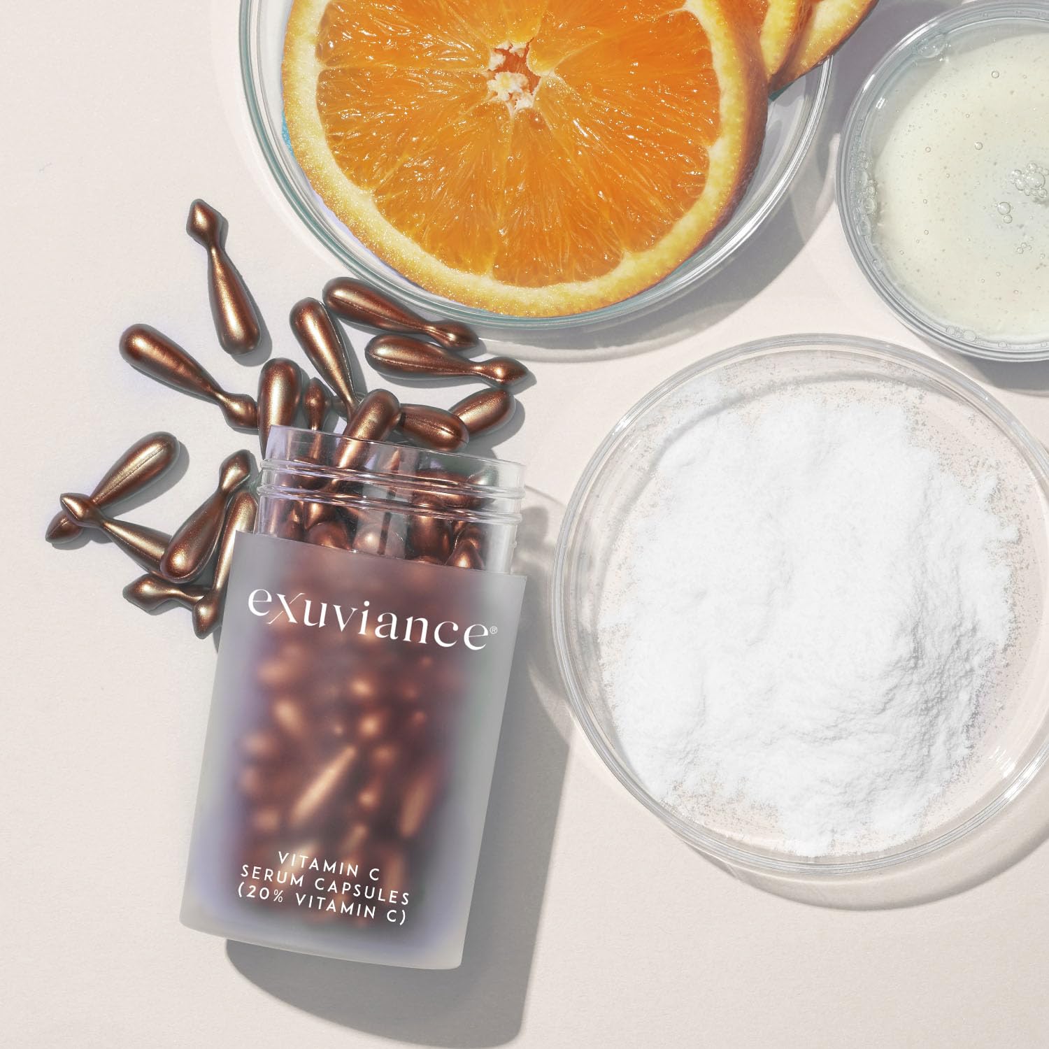 EXUVIANCE box and bottle on a vanity ritual-ready setup.