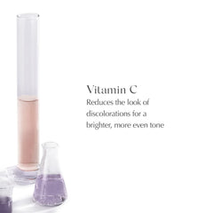 EXUVIANCE serum being applied on clean skin for smoother look.