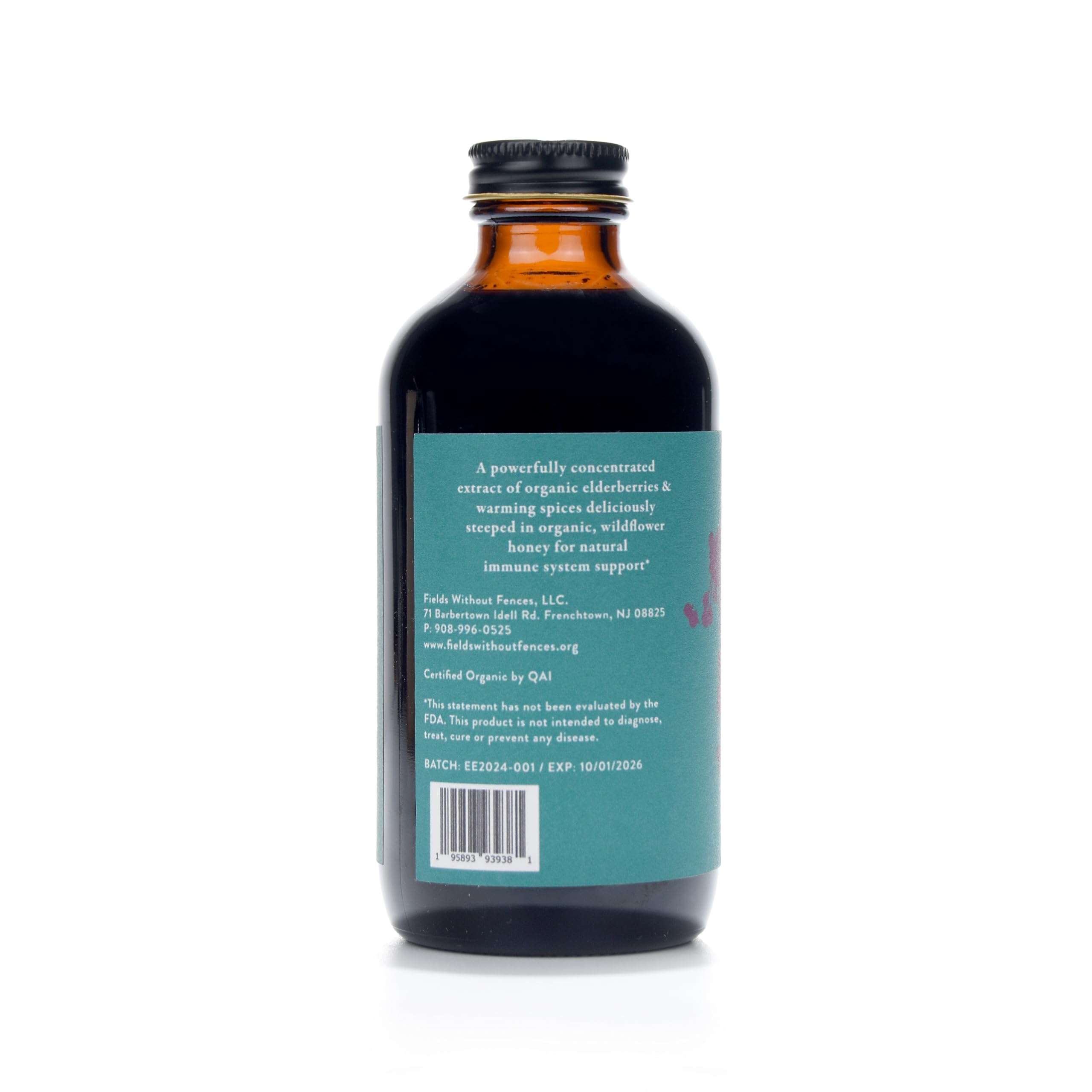 Fields Without Fences Elderberry Elixir on kitchen counter, fresh elderberries and spices suggest comforting daily use.