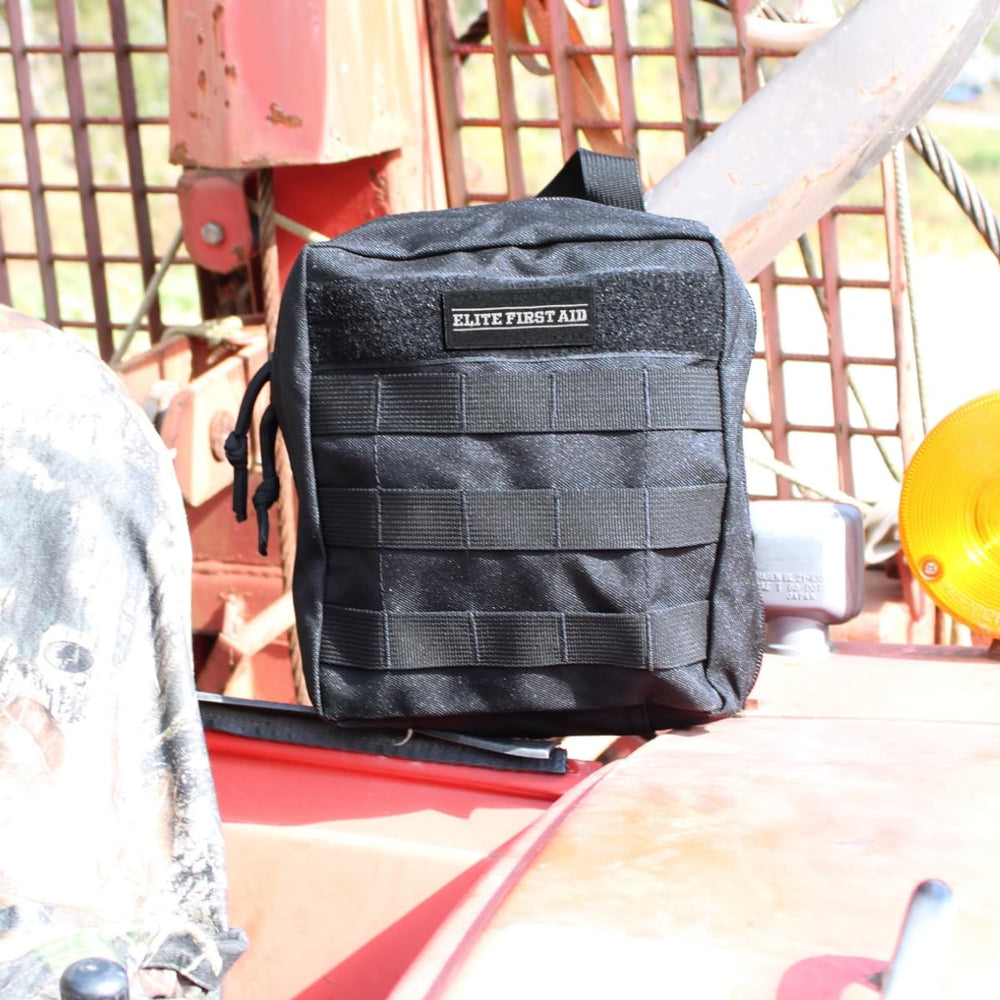 MOLLE pouch secures Elite IFAK for quick vehicle access
