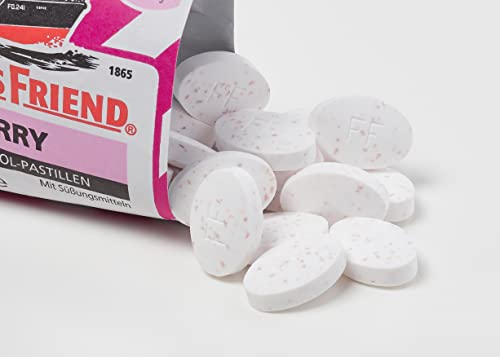 Open Fisherman's Friend Raspberry Sugar Free pack showing individual wrappers.