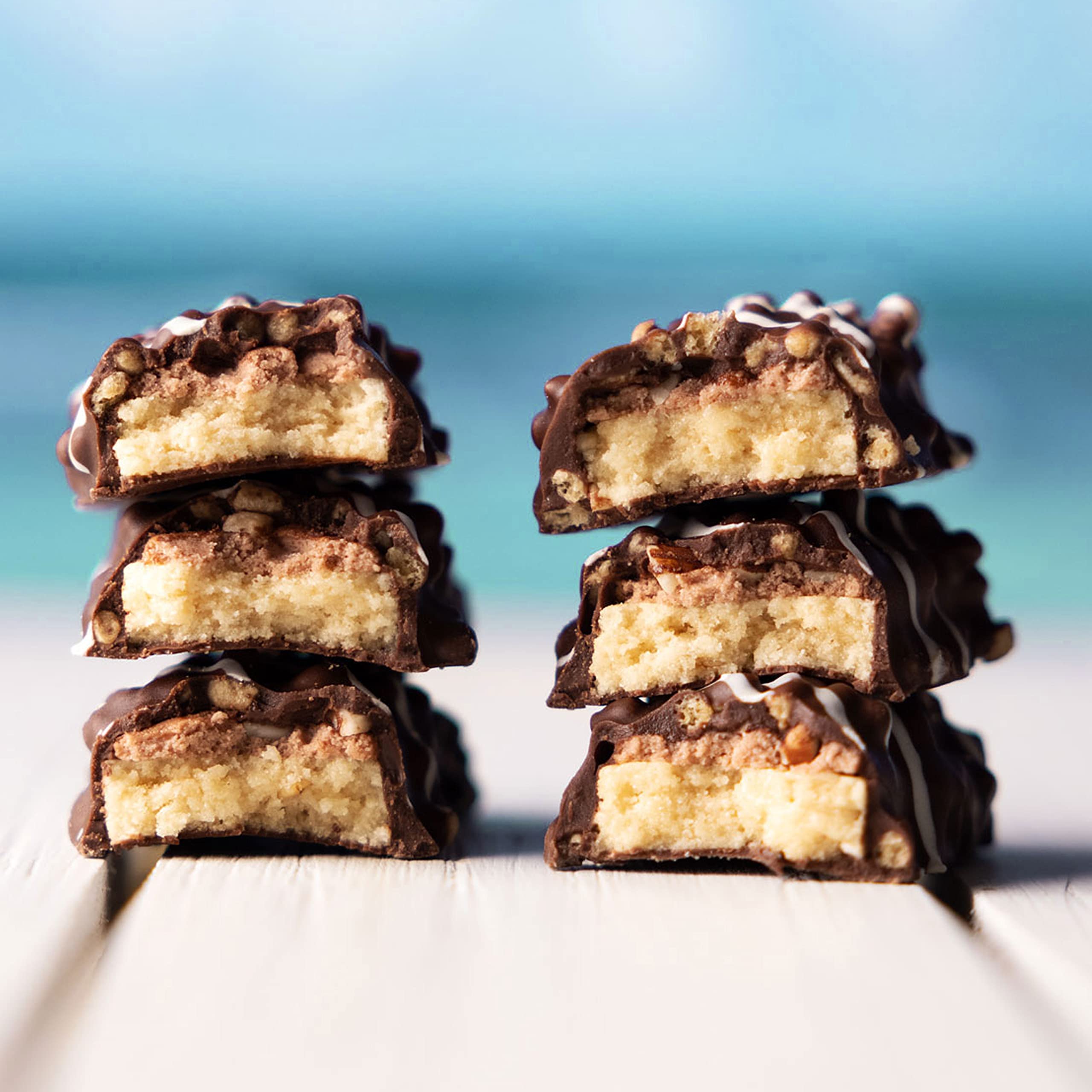 Six-layer baked bar visual hints at texture and indulgent appeal.