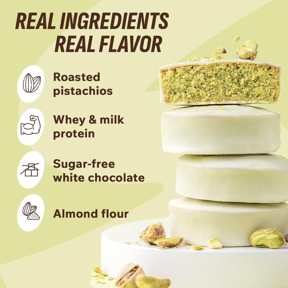 FitnesSHOCK pistachio brownie slice highlighting vibrant nutty topping, great with coffee.