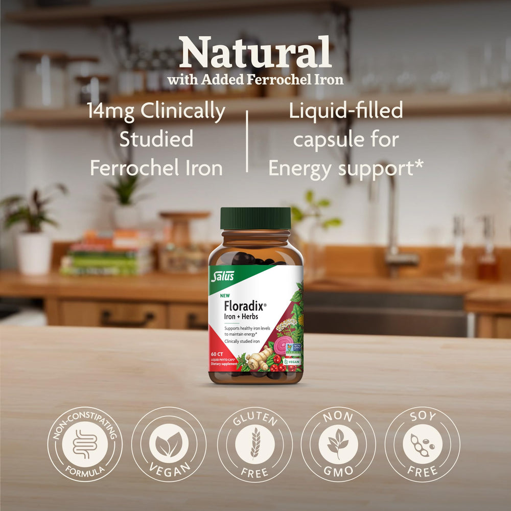 Floradix phyto-caps dispensed glass shows vegan iron pairing for daily vitality.