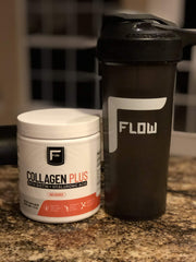 Flow Supps Collagen Plus jar on kitchen counter with grass-fed badge.