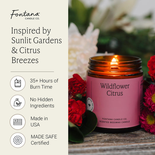 Fontana Candle Co Wildflower Citrus in glass jar front view with warm glow.