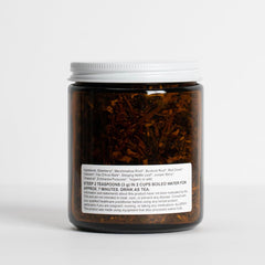 Food Over Drugs detox tea loose-leaf close-up highlights regenerative herbs in vibrant leaves.