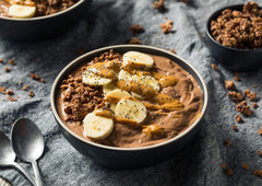 Food to Live amla powder over yogurt bowl, healthy topping idea.