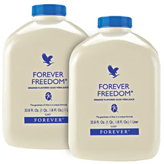 Forever Living Forever Freedom bottle being poured, highlighting orange flavor and potential daily support.