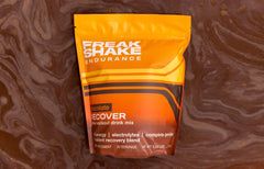 Freak Shake Recover chocolate sachet front highlights convenient single-serve mixing.