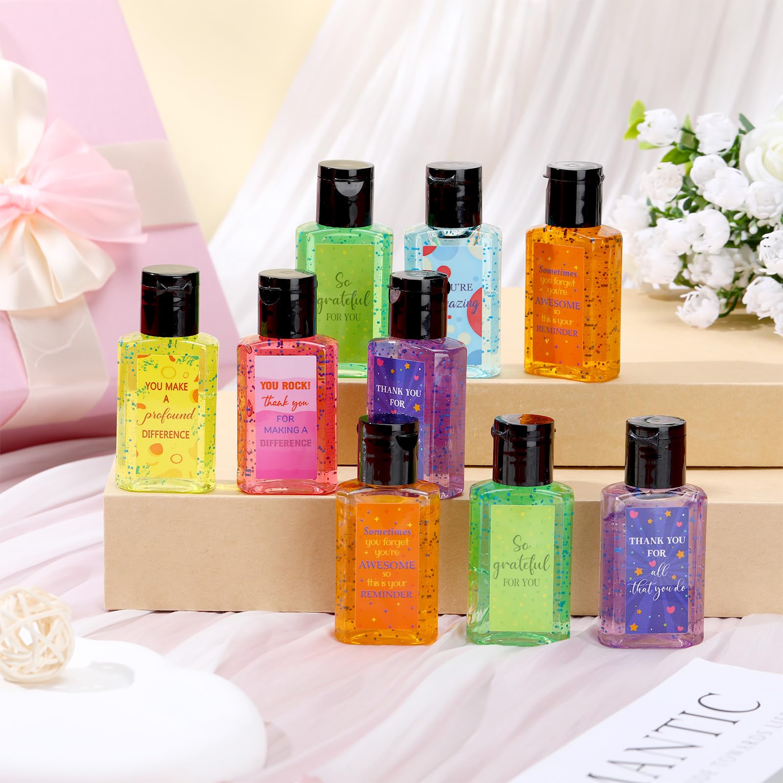 Frienda mini sanitizer rose scent in pink bottle for uplifting team moments.