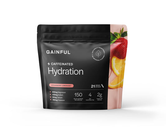 Gainful Hydration Strawberry Lemonade packets in glass for on-the-go refreshment.