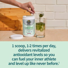 Garden of Life Sport Greens Apple Berry powder pouring into water, quick nutrient boost.