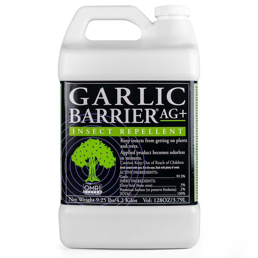 Garlic Barrier 2002 AG+ liquid spray bottle shows natural pest deterrence for gardens