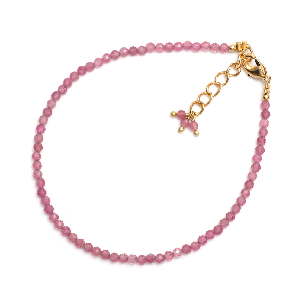 GEMPIRES NATURES TREASURE close-up of pink tourmaline beads rich color.