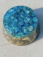Generic Blue Topaz single crystal tower buster orgonite on display for ambient energy and decor
