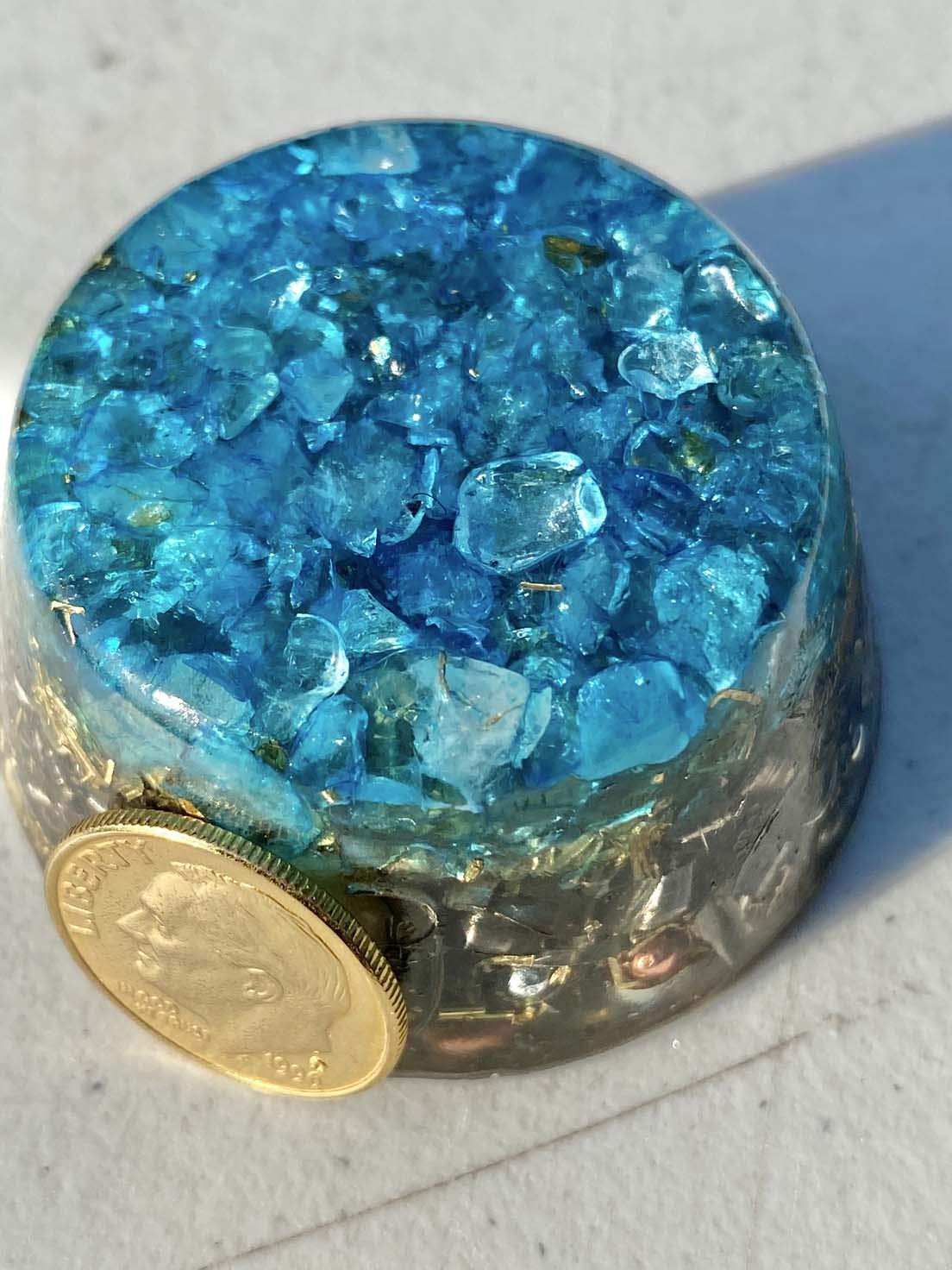 Generic miniature orgonite with blue topaz highlights as decorative energy piece