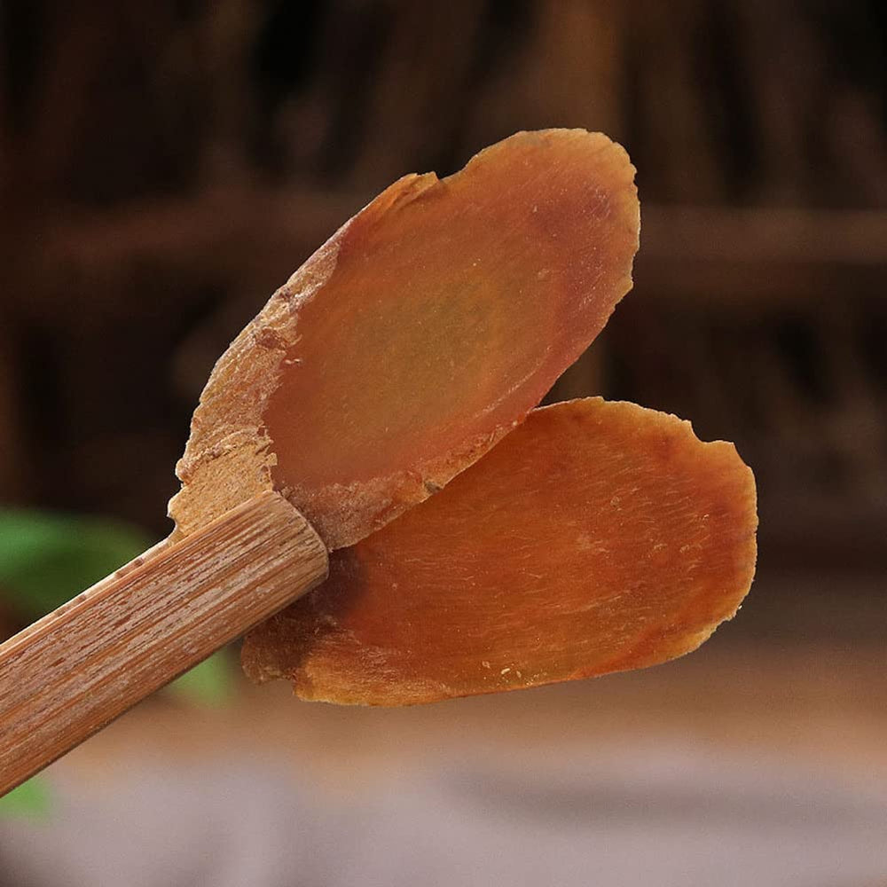 Generic natural ginseng root slices raw texture ready for infusion.