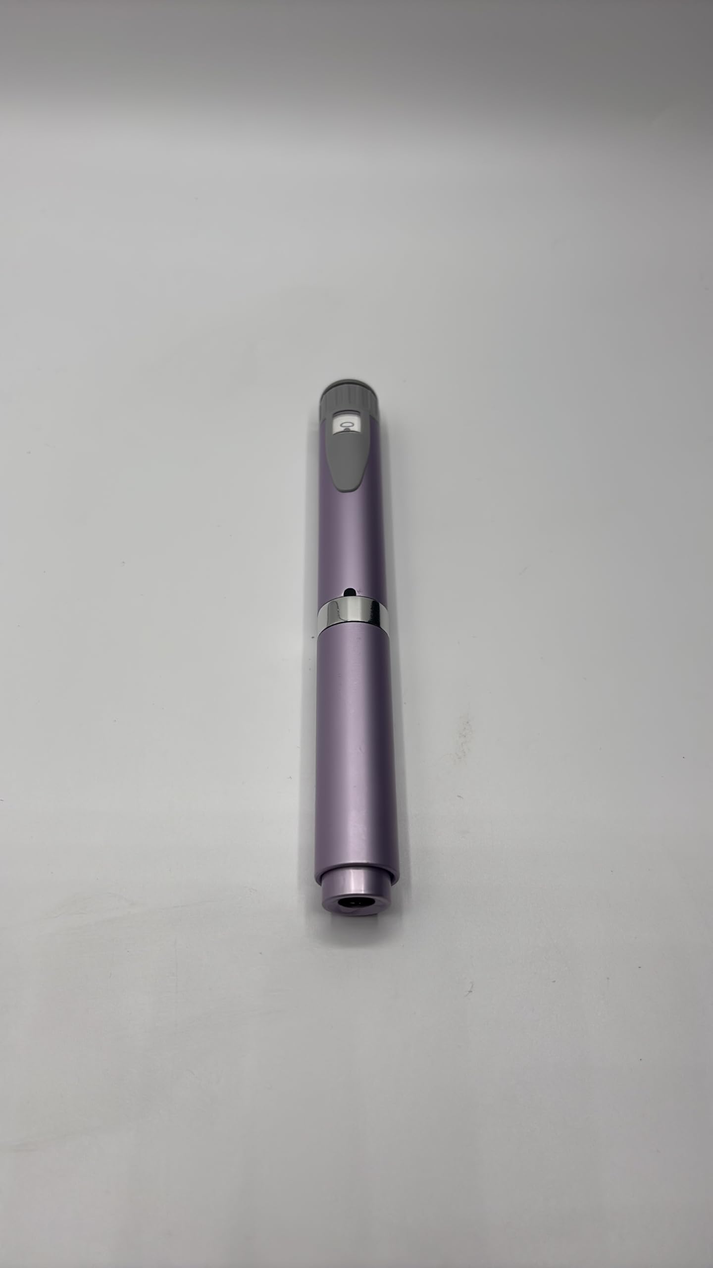 Generic reusable injection pen violet with cartridge, front view, compact and portable.