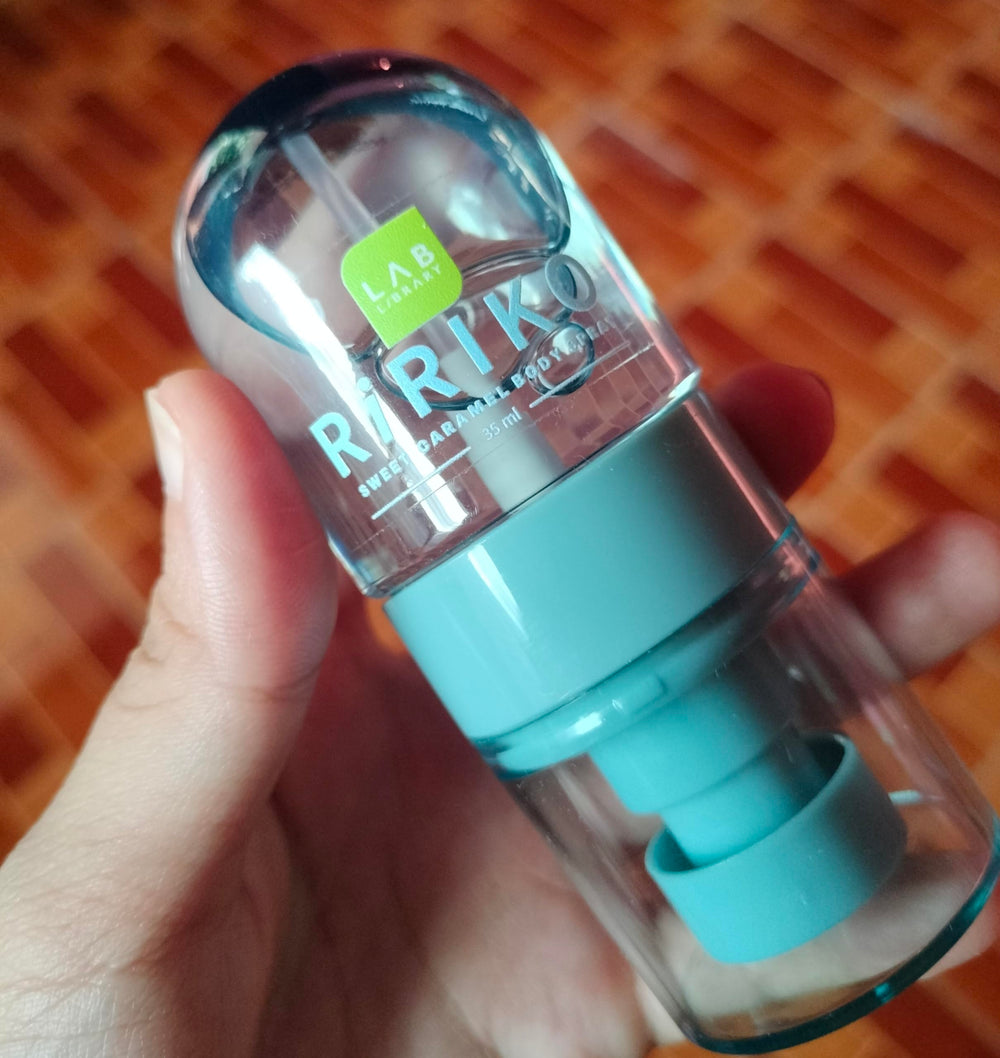 Travel-size Ririko Sweet Caramel Body Mist held in hand