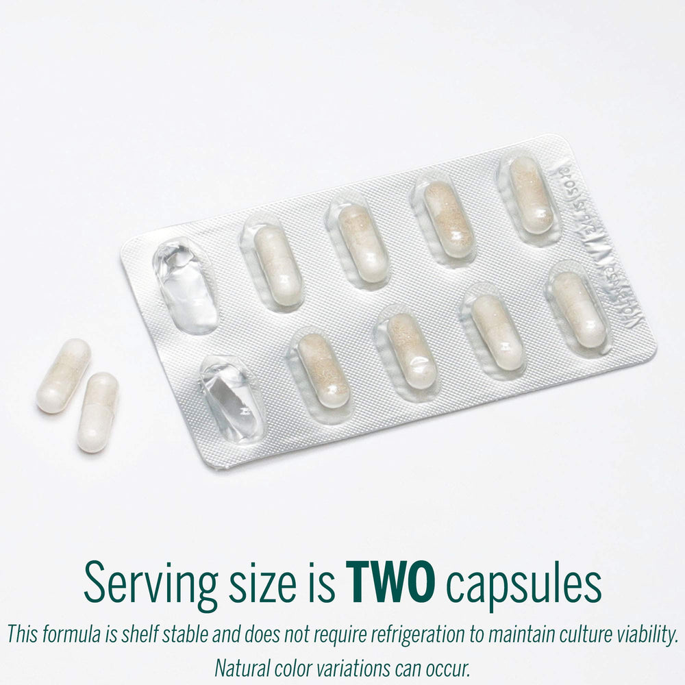HMF Travel capsule close-up with bottle label and dosage details.