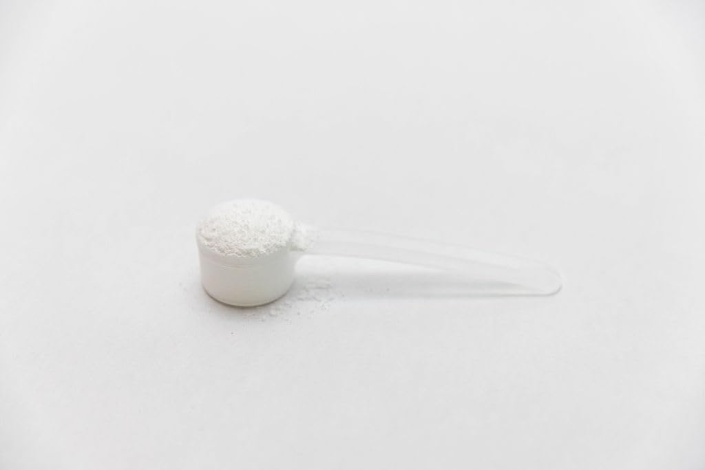 Genetic Edge Compounds Creatine HCl HMB athlete training with bottle.