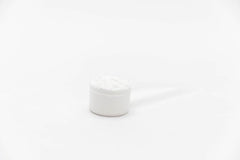 Powder being stirred in water to create a refreshing pre-workout shake.