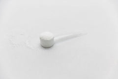 Genetic Edge Compounds Creatine HCl + HMB glass of water ready to mix.