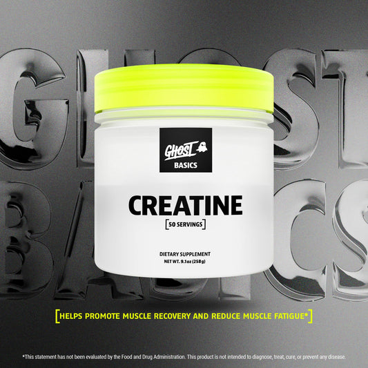 Ghost Basics Creatine powder being mixed in a glass for convenient pre- or post-workout use