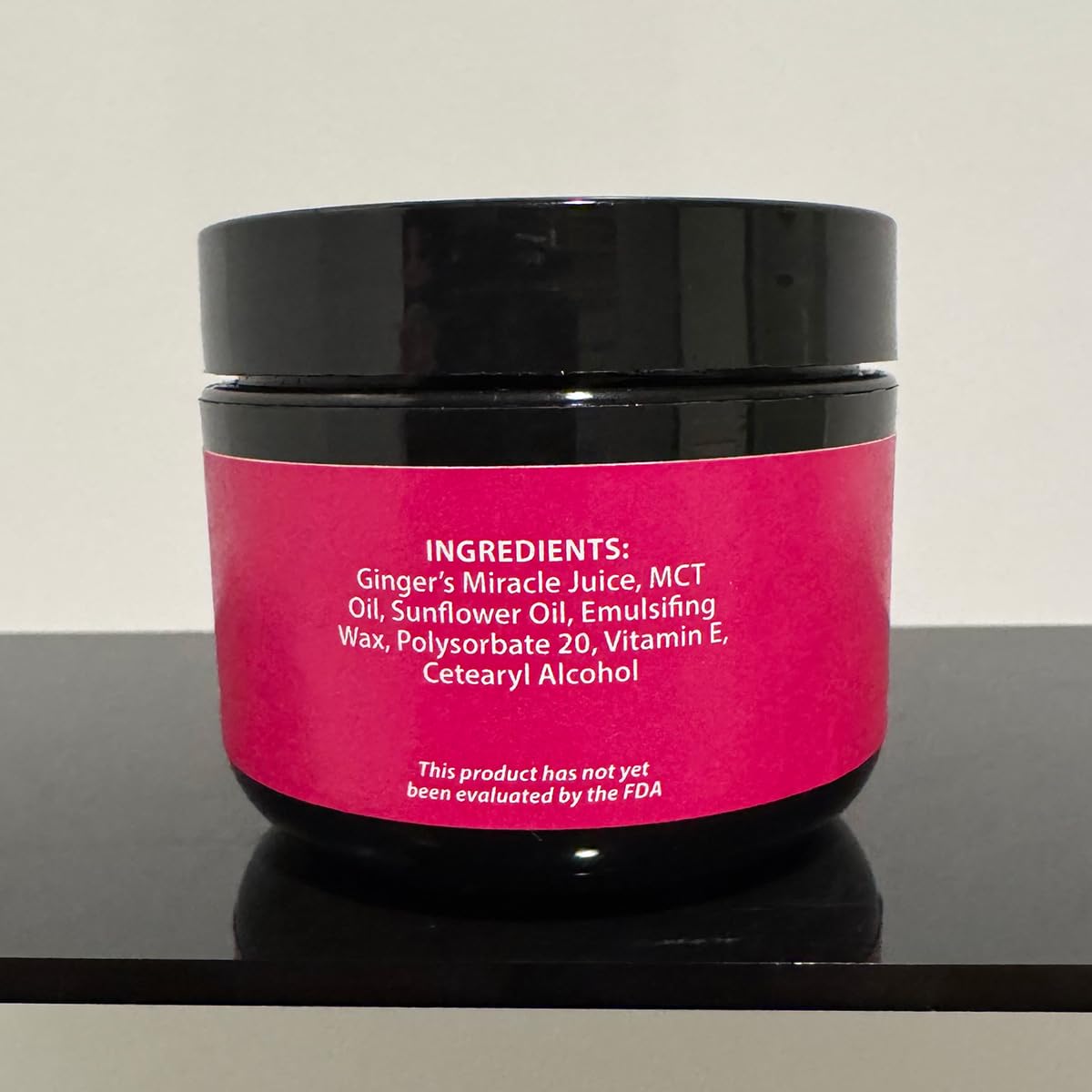 Texture close-up of Ginger's Miracle Cream highlights smooth, non-greasy hydration.