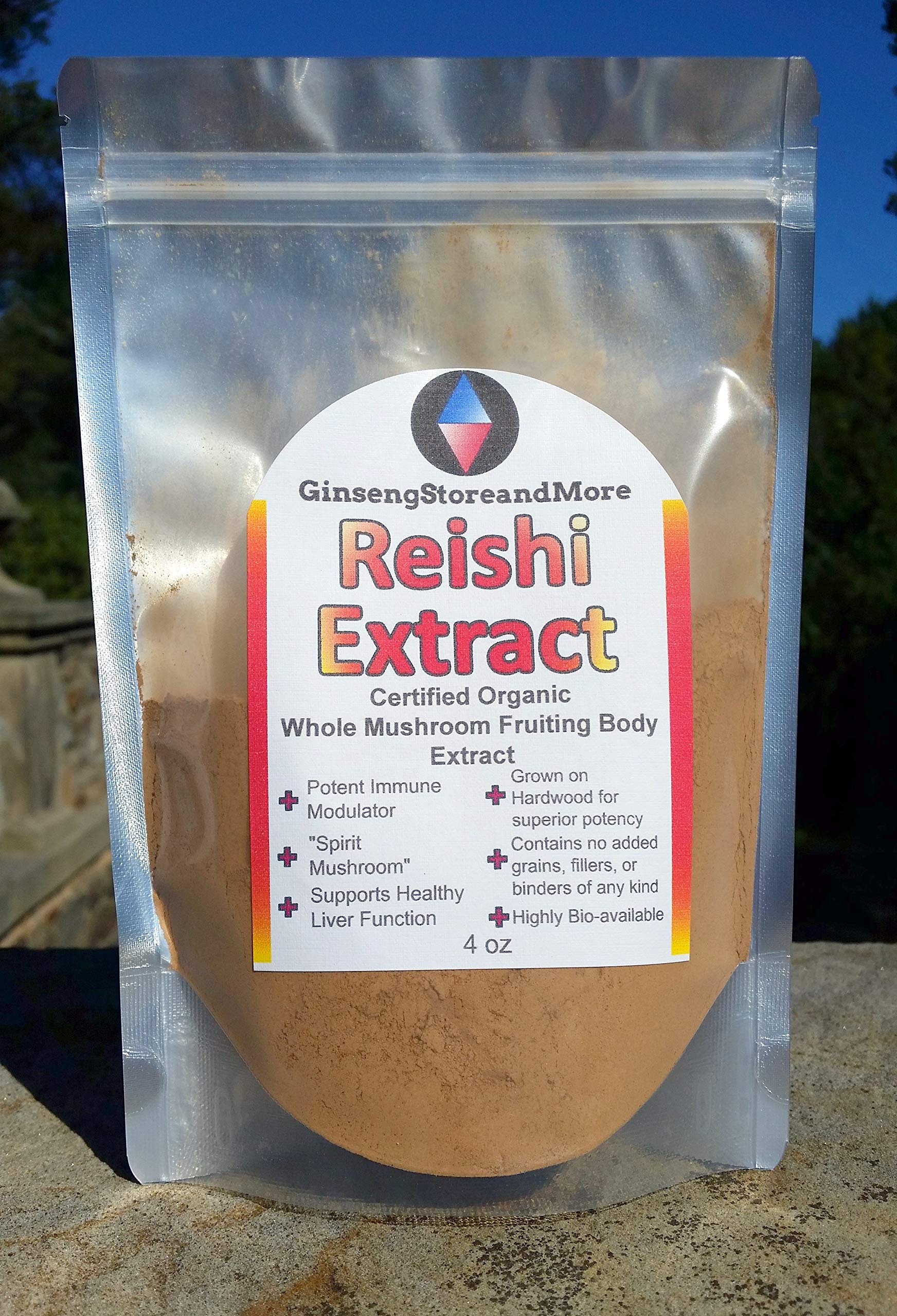 GinsengStoreAndMore Red Reishi on wood surface, pure extract.