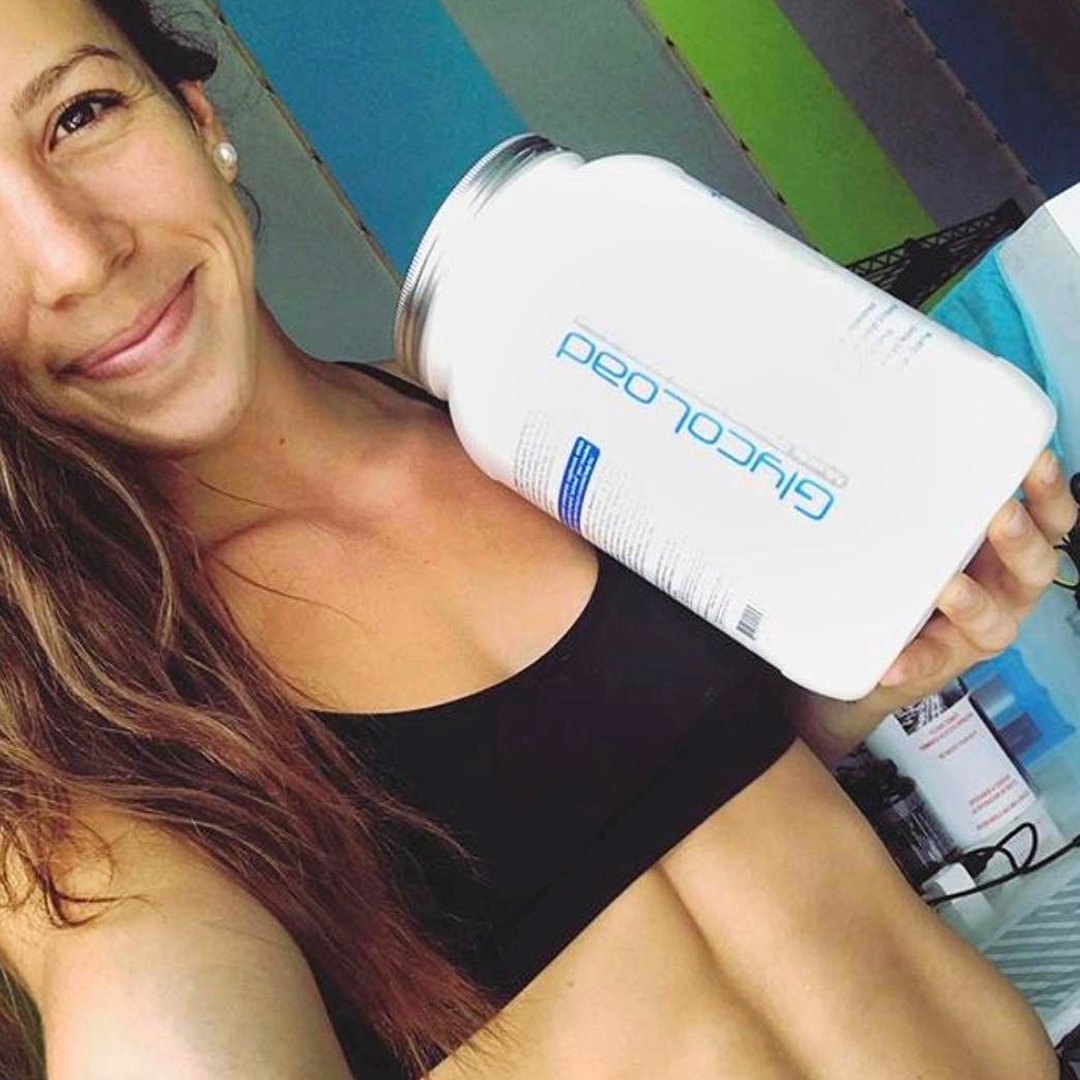 Blue raspberry Glycoload tub with gym bag signals pre- or intra-workout use.